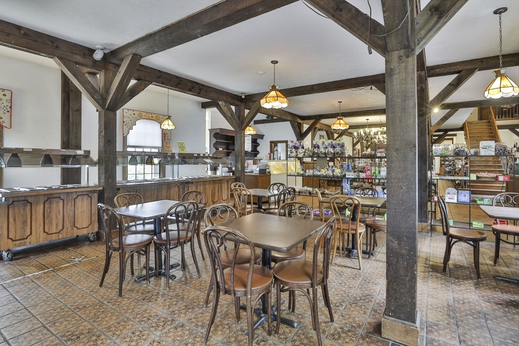 47 Sugar Road Bolton, MA 01740 - Photo 17 of 42 a dining area with furniture and outdoor view