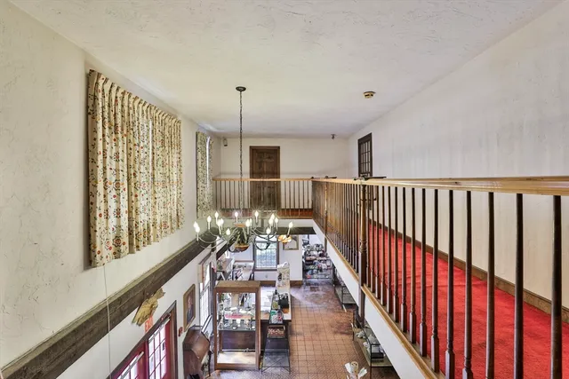 a view of staircase with lots of wooden floor and windows