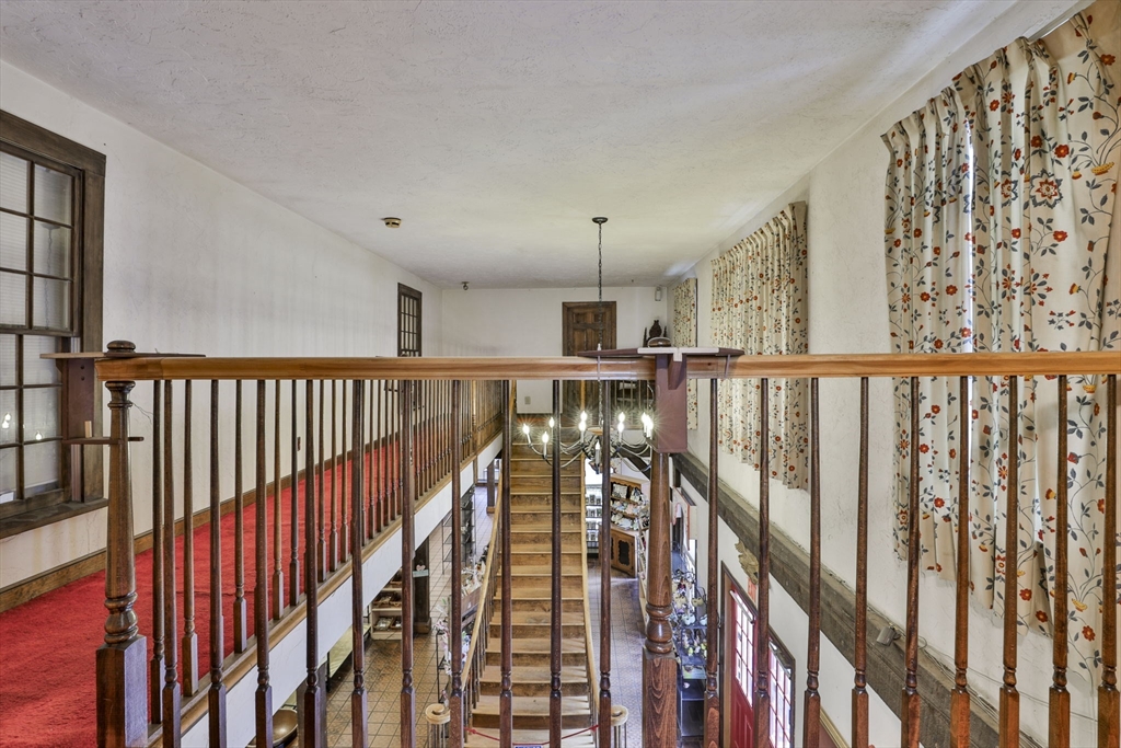 47 Sugar Road Bolton, MA 01740 - Photo 20 of 42 a view of staircase with lots of wooden floor and windows