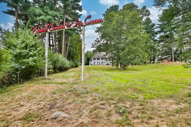 a view of a tree in front of a house