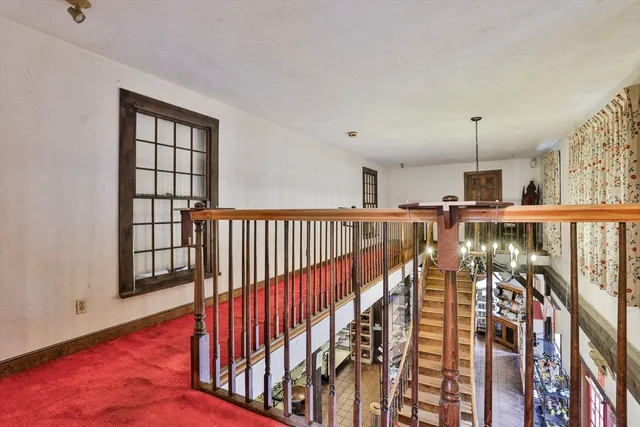 a room with lots of furniture and white walls