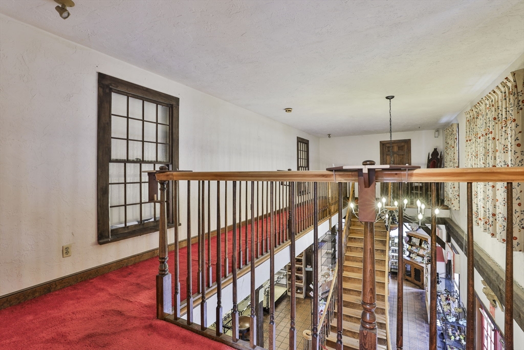 47 Sugar Road Bolton, MA 01740 - Photo 21 of 42 a view of a hallway with wooden floor and entryway