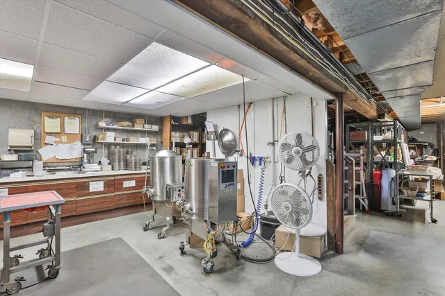 a living room with furniture a clock and a window