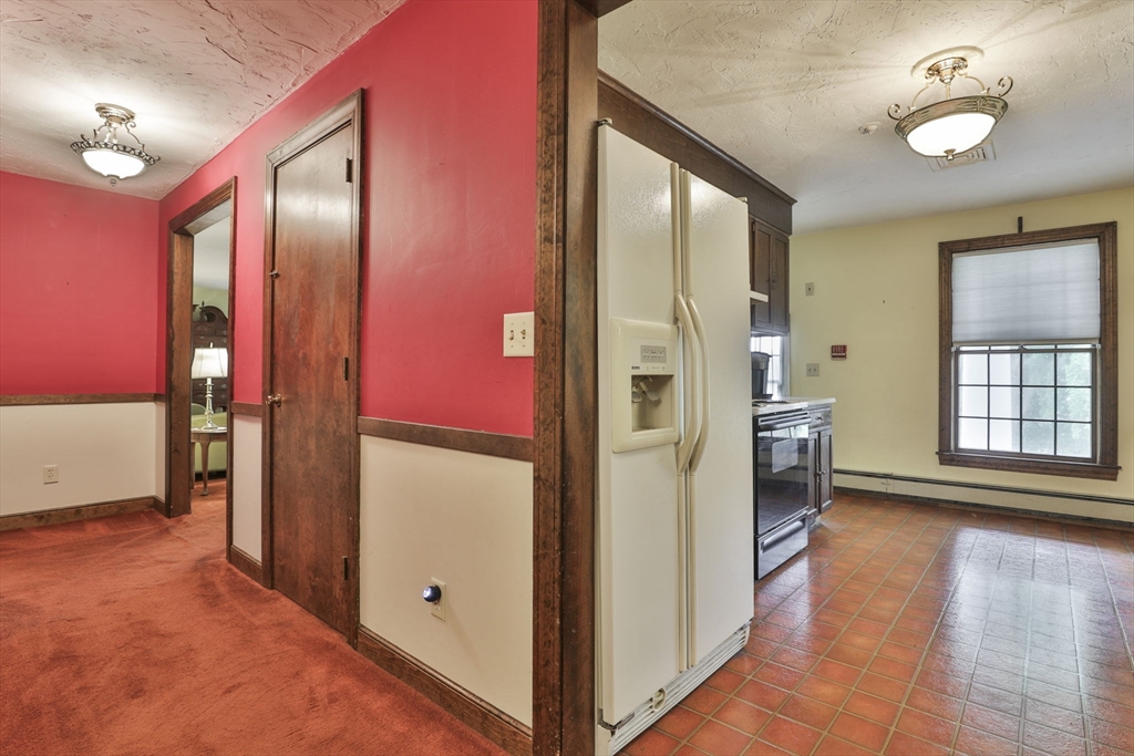 47 Sugar Road Bolton, MA 01740 - Photo 28 of 42 a view of a hallway with closet and a large window