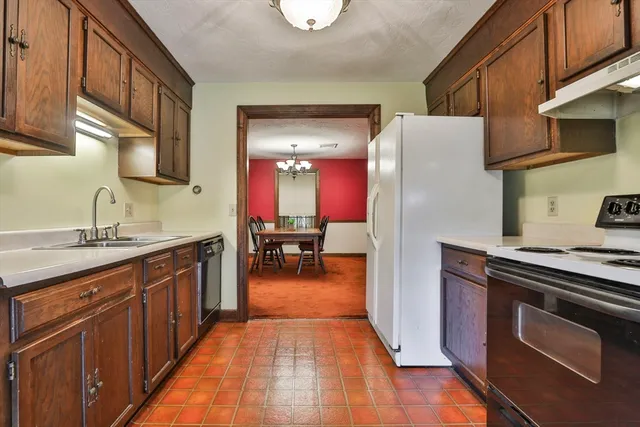 a view of a livingroom with furniture window and wooden floor