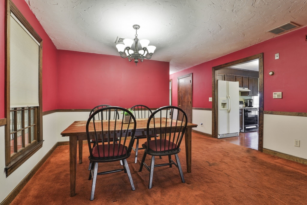 47 Sugar Road Bolton, MA 01740 - Photo 30 of 42 a view of a livingroom with furniture window and wooden floor