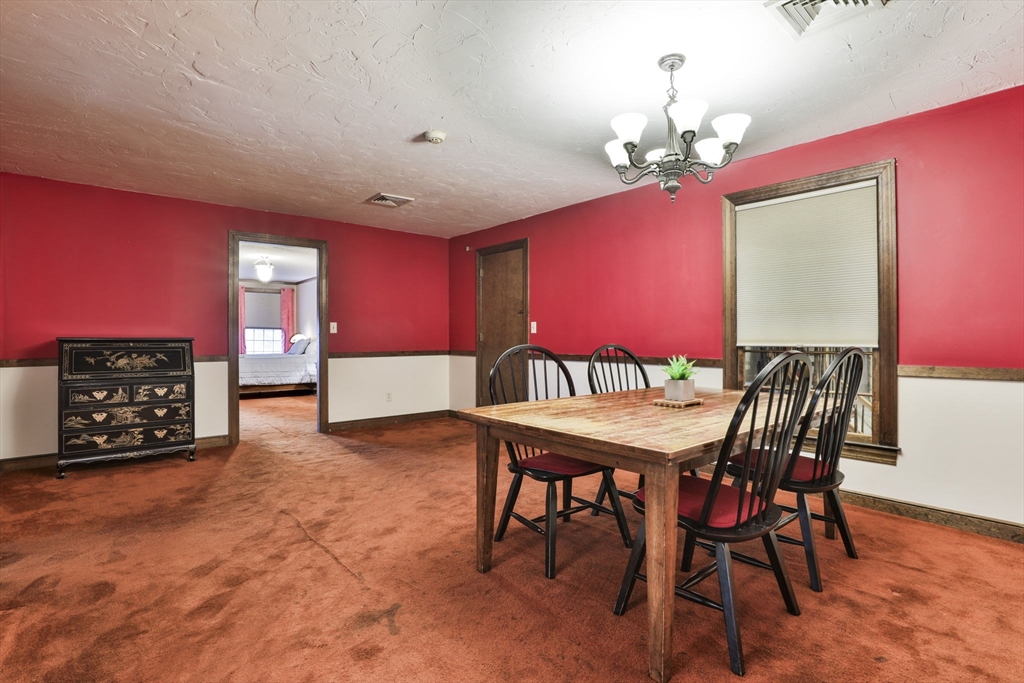 47 Sugar Road Bolton, MA 01740 - Photo 32 of 42 a view of a dining room with furniture