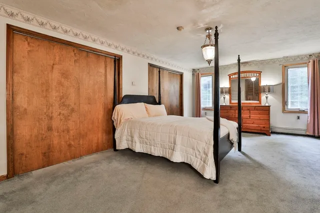 a bed room with a bed and a window