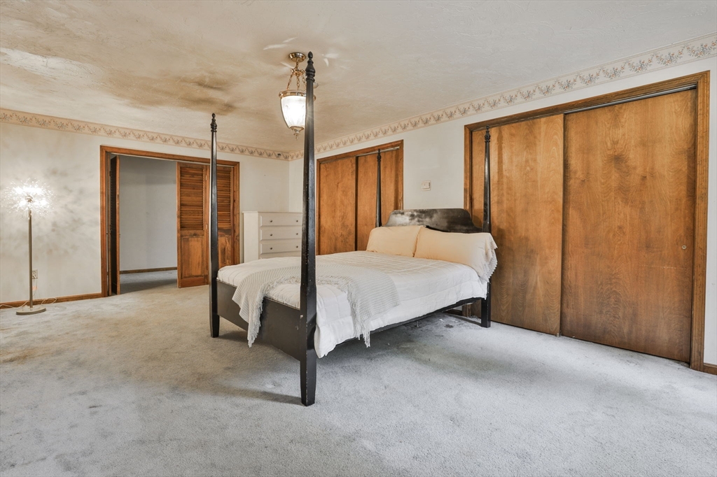 47 Sugar Road Bolton, MA 01740 - Photo 36 of 42 a bed room with a bed and a window