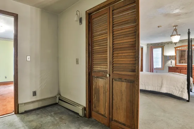 a bedroom with a bed a desk and chair