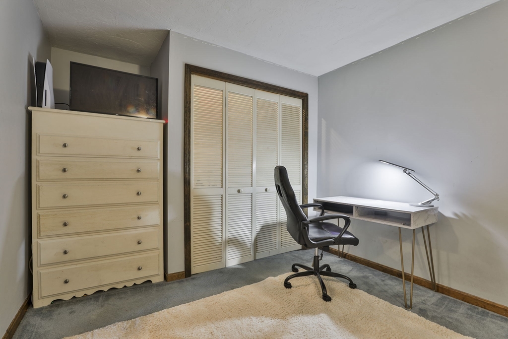 47 Sugar Road Bolton, MA 01740 - Photo 40 of 42 a view of a workspace with furniture