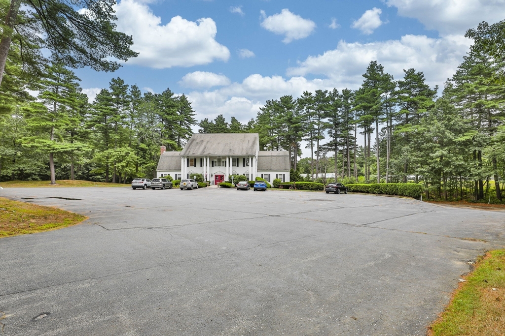 47 Sugar Road Bolton, MA 01740 - Photo 4 of 42 a view of swimming pool with outdoor seating and trees in the background