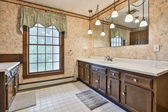 a bathroom with a sink double vanity and a mirror