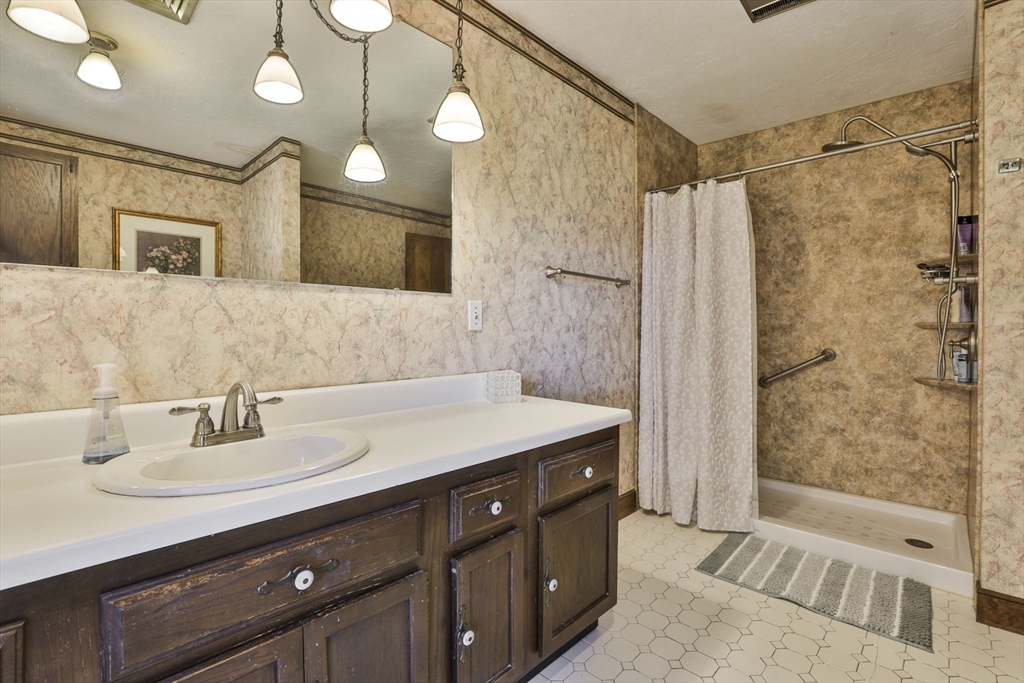 47 Sugar Road Bolton, MA 01740 - Photo 42 of 42 a bathroom with a sink double vanity and a mirror