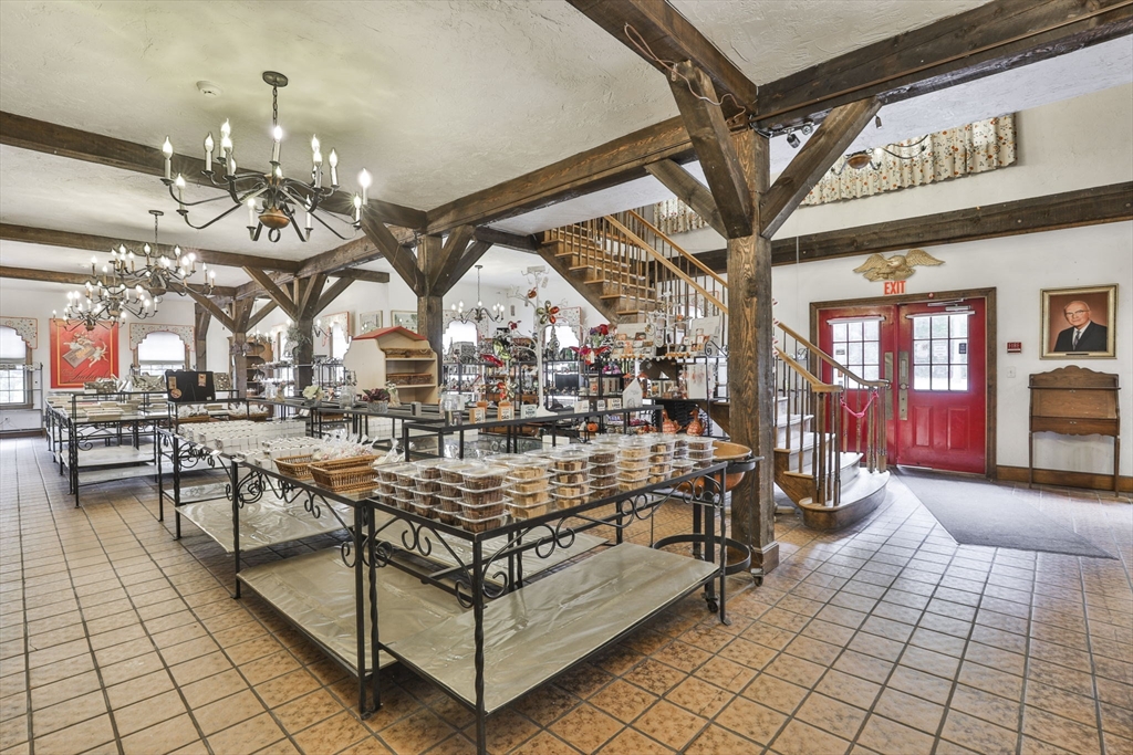 47 Sugar Road Bolton, MA 01740 - Photo 10 of 42 a view of a chairs and tables in a patio