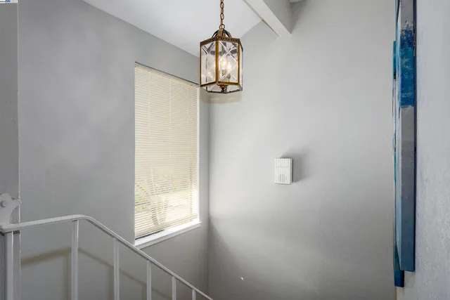 a view of a hallway with windows