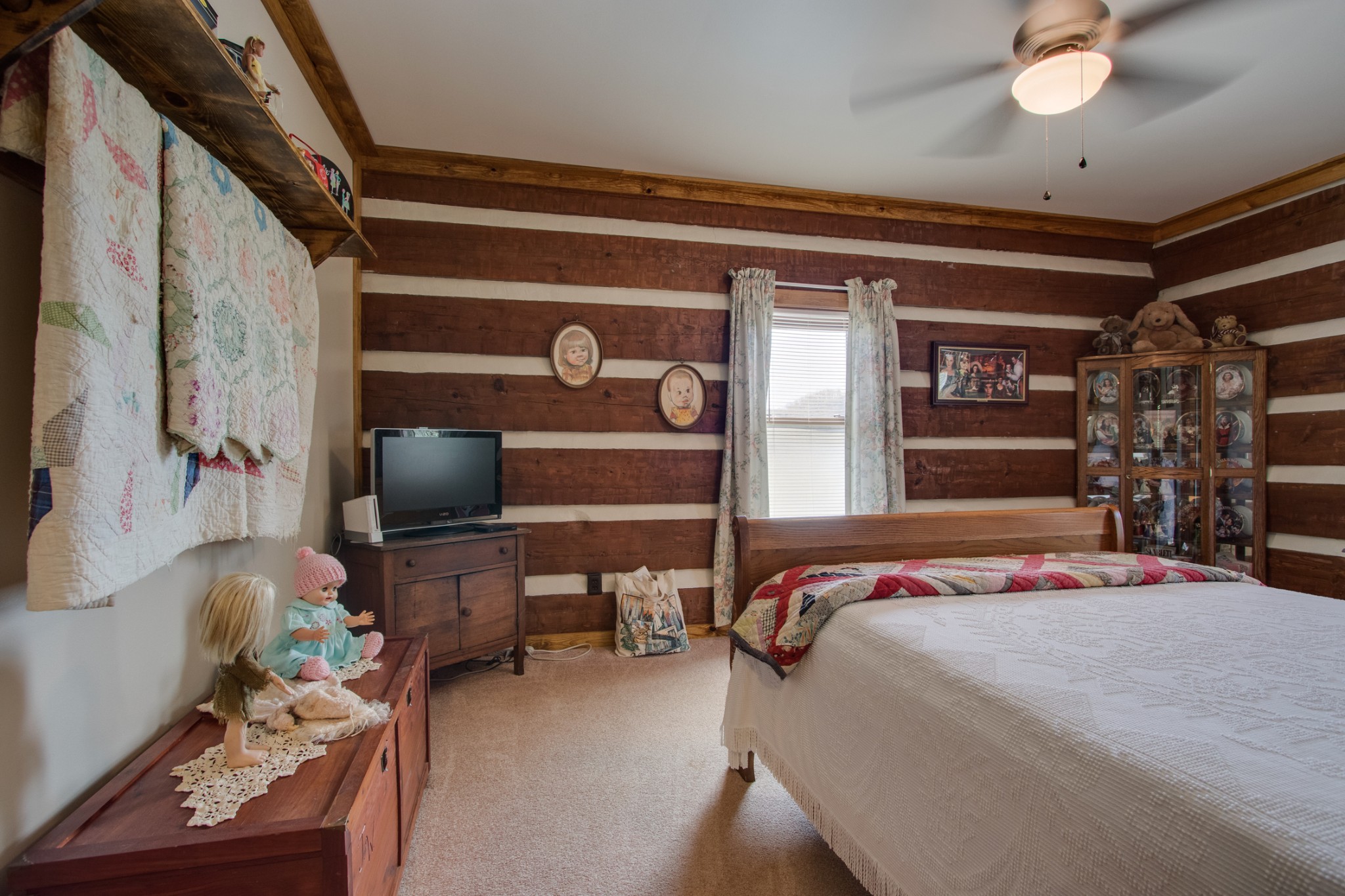 25 Cages Bend Lane Riddleton, TN 37151 - Photo 36 of 50 a bedroom with a bed and a chandelier