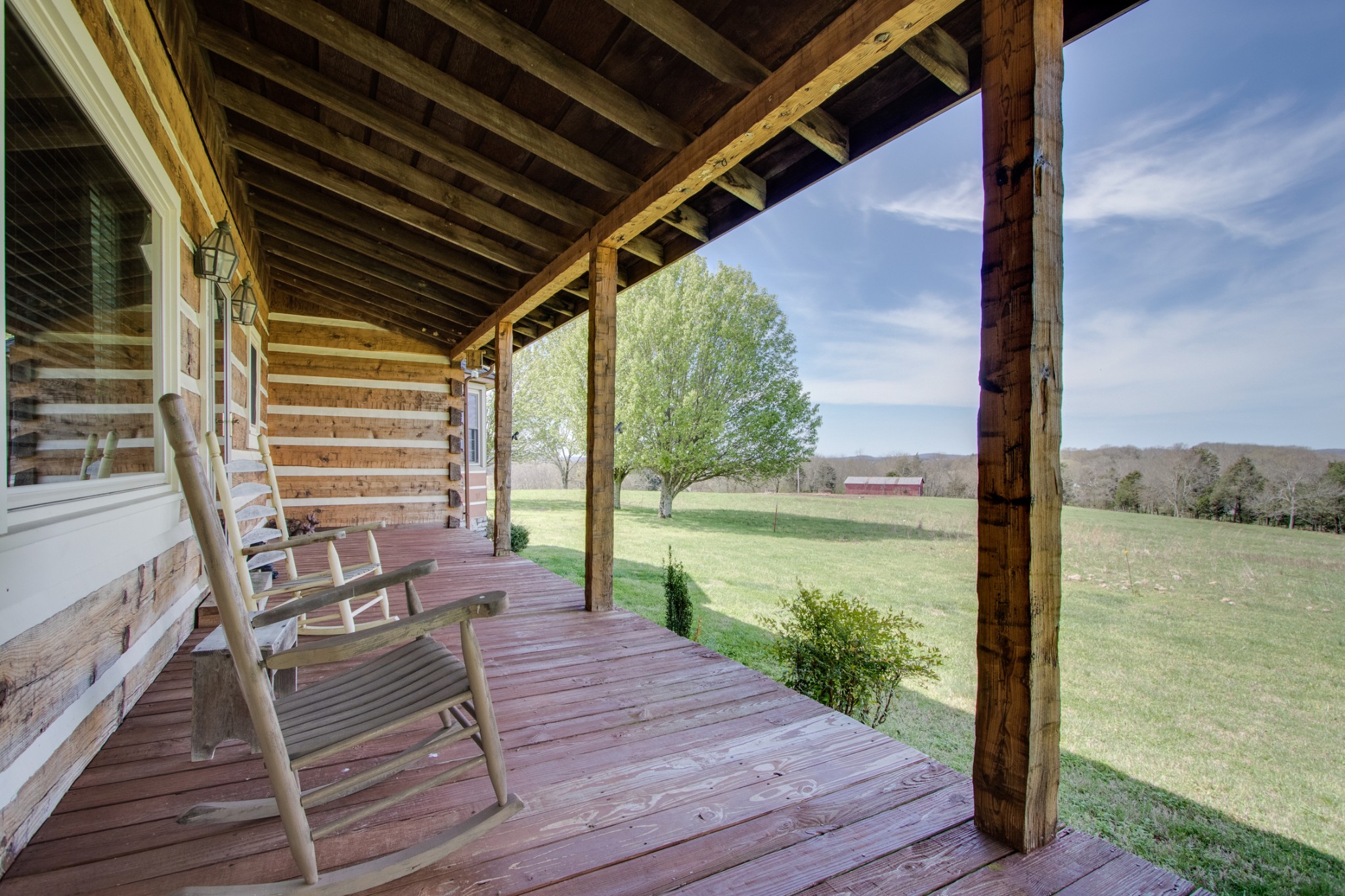 25 Cages Bend Lane Riddleton, TN 37151 - Photo 9 of 50 a view of a balcony with chair and wooden floor