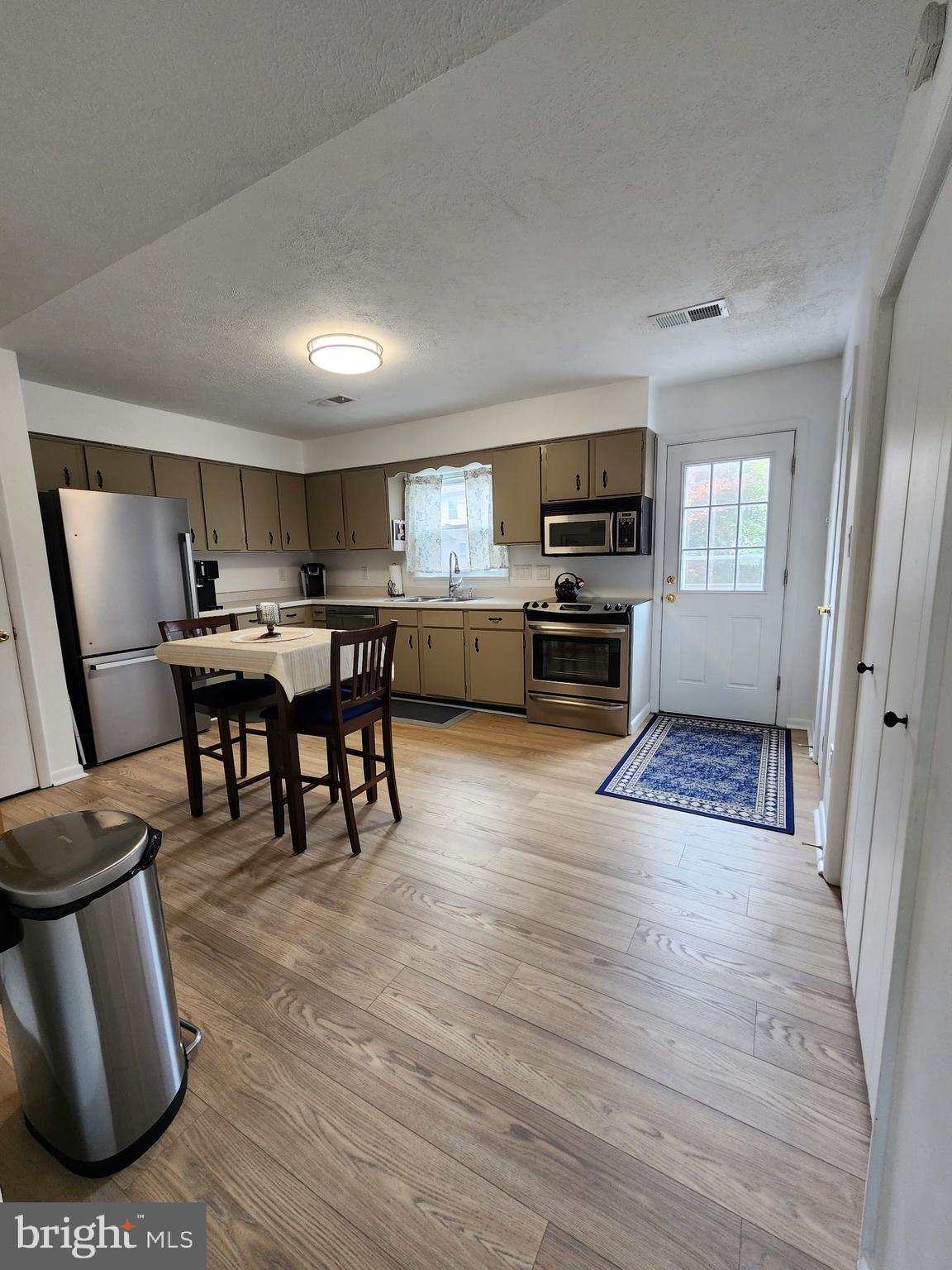 243 Brunswick Road Stephens City, VA 22655 - Photo 4 of 24 13x16 Kitchen with new LVP & stainless appliances