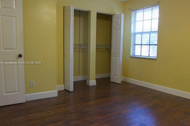 4345 Northwest 69th Terrace, Unit 4345 Lauderhill, FL 33319 - Photo 14 of 20 an empty room with wooden floor and windows