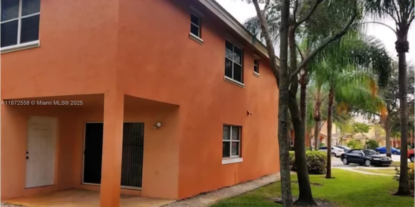 4345 Northwest 69th Terrace, Unit 4345 Lauderhill, FL 33319 - Photo 19 of 20 a view of a house with a yard