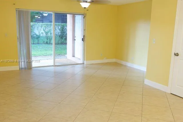 a view of an empty room with a glass door