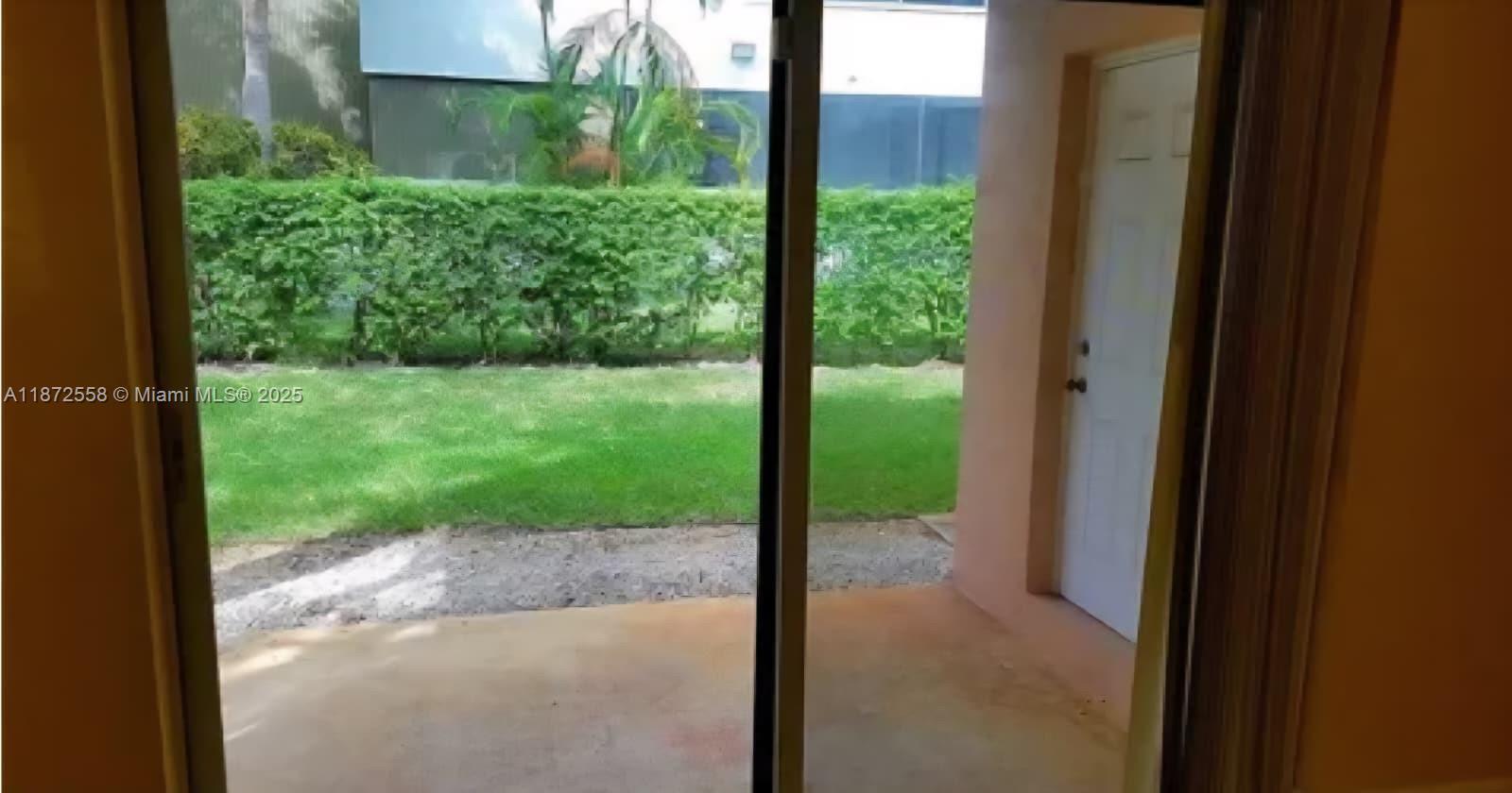 4345 Northwest 69th Terrace, Unit 4345 Lauderhill, FL 33319 - Photo 10 of 20 a view of a backyard of the house