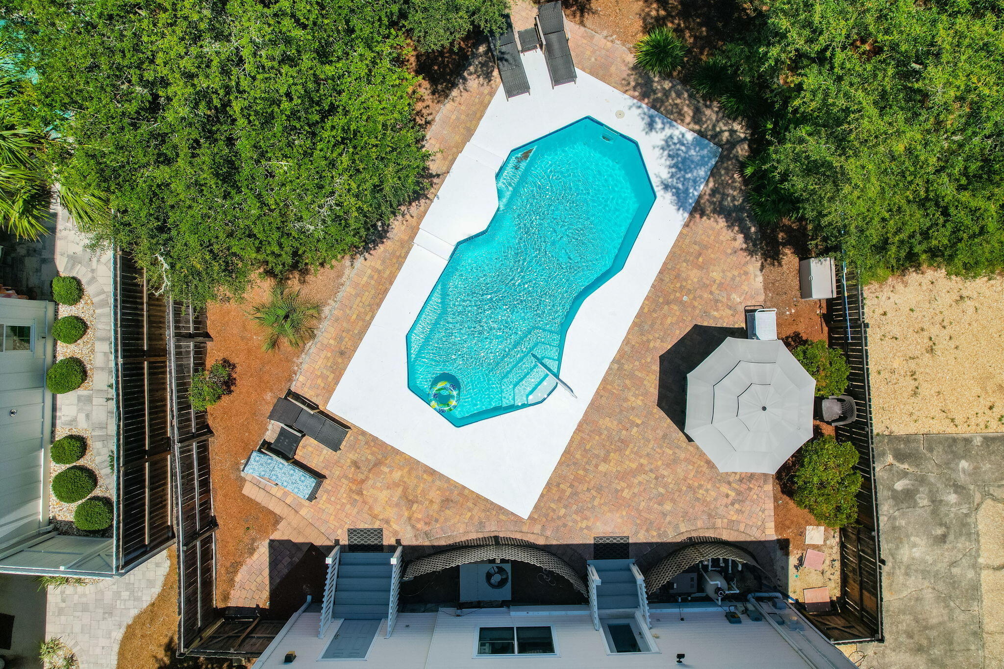 8009 East County Highway 30A Inlet Beach, FL 32461 - Photo 11 of 53 an aerial view of a backyard with swimming pool and outdoor seating