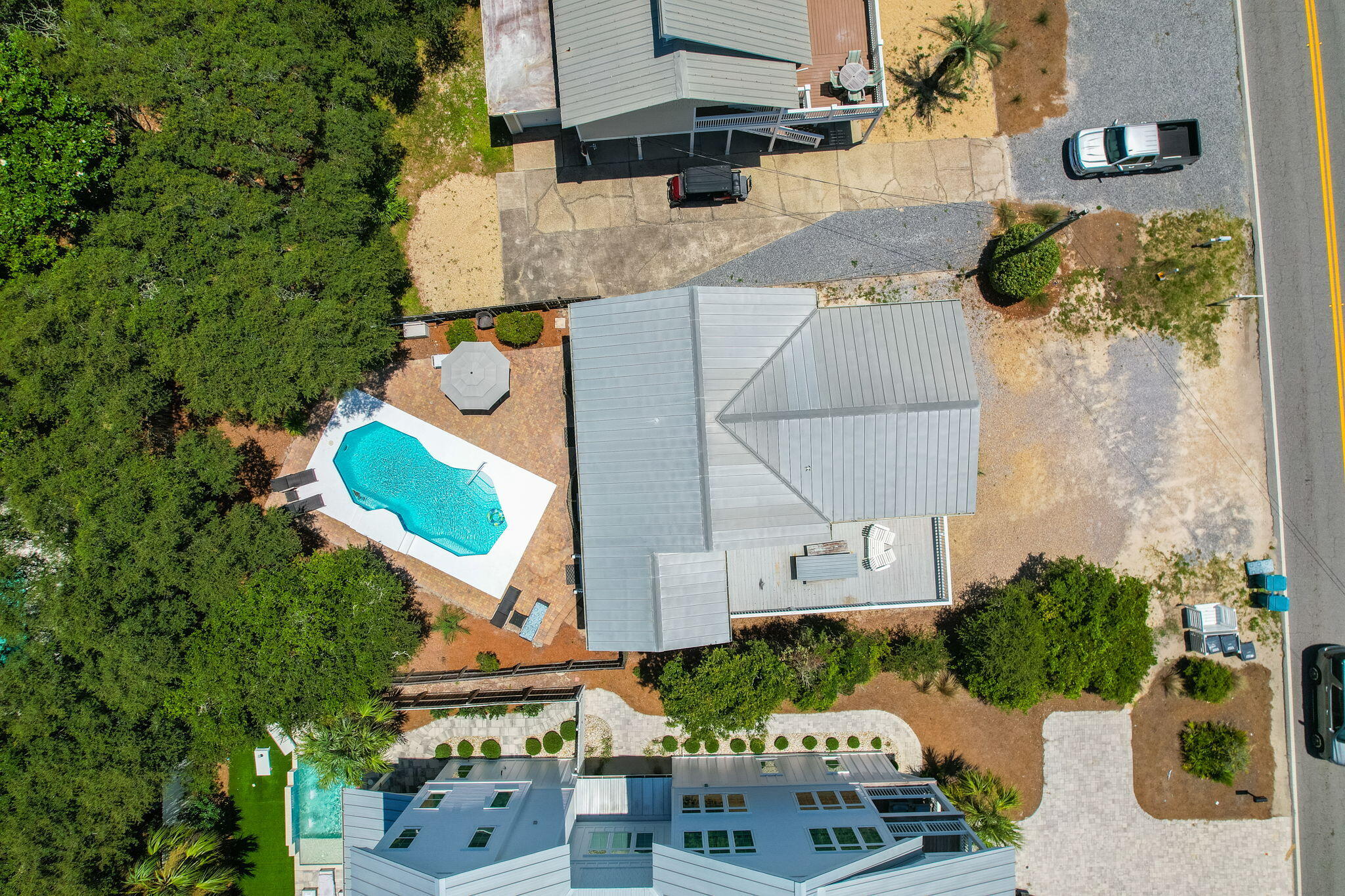 8009 East County Highway 30A Inlet Beach, FL 32461 - Photo 16 of 56 an aerial view of a house with a yard and seating area