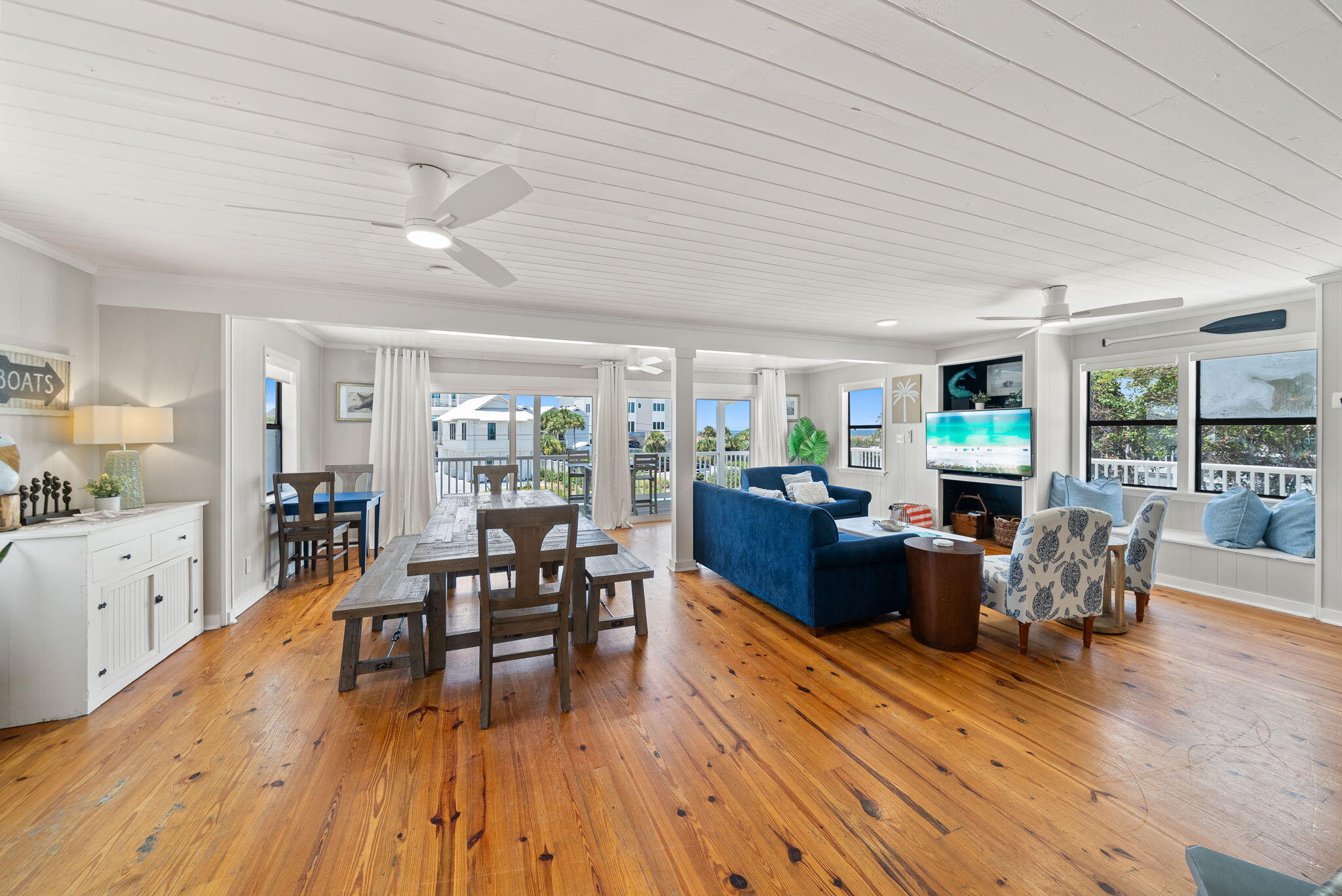 8009 East County Highway 30A Inlet Beach, FL 32461 - Photo 2 of 53 a living room with fireplace furniture wooden floor and a large window