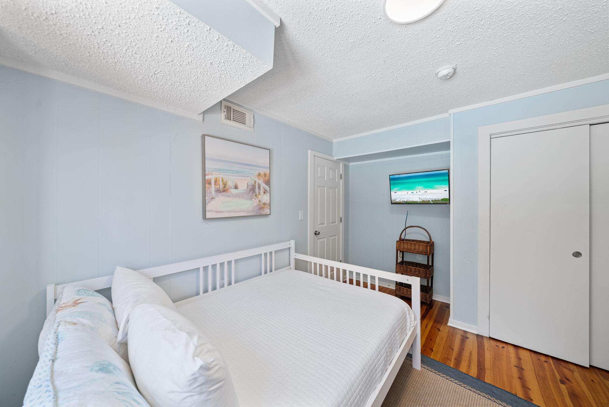 8009 East County Highway 30A Inlet Beach, FL 32461 - Photo 25 of 53 a bedroom with a bed and a flat screen tv