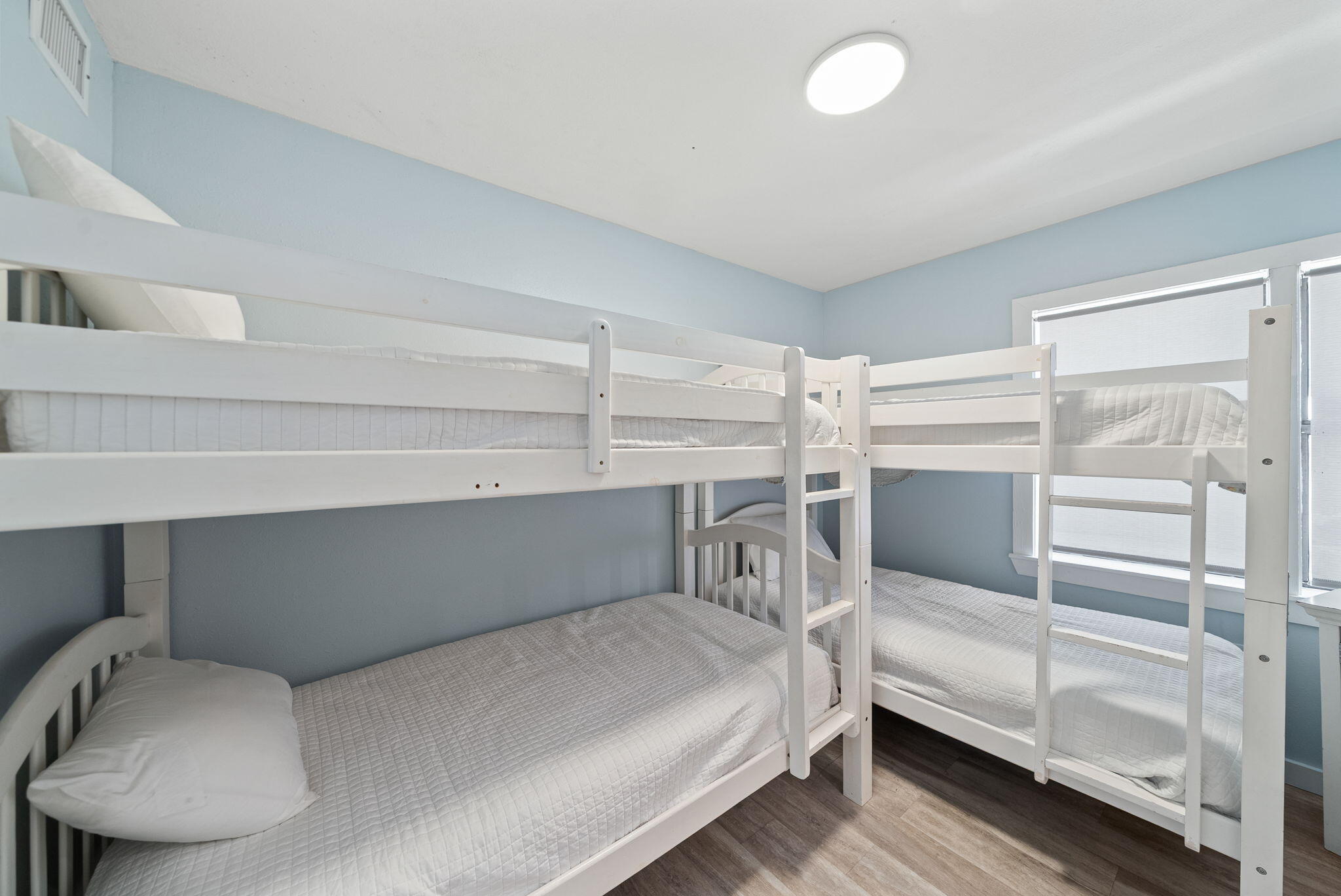 8009 East County Highway 30A Inlet Beach, FL 32461 - Photo 27 of 53 a bedroom with a bed and a chair