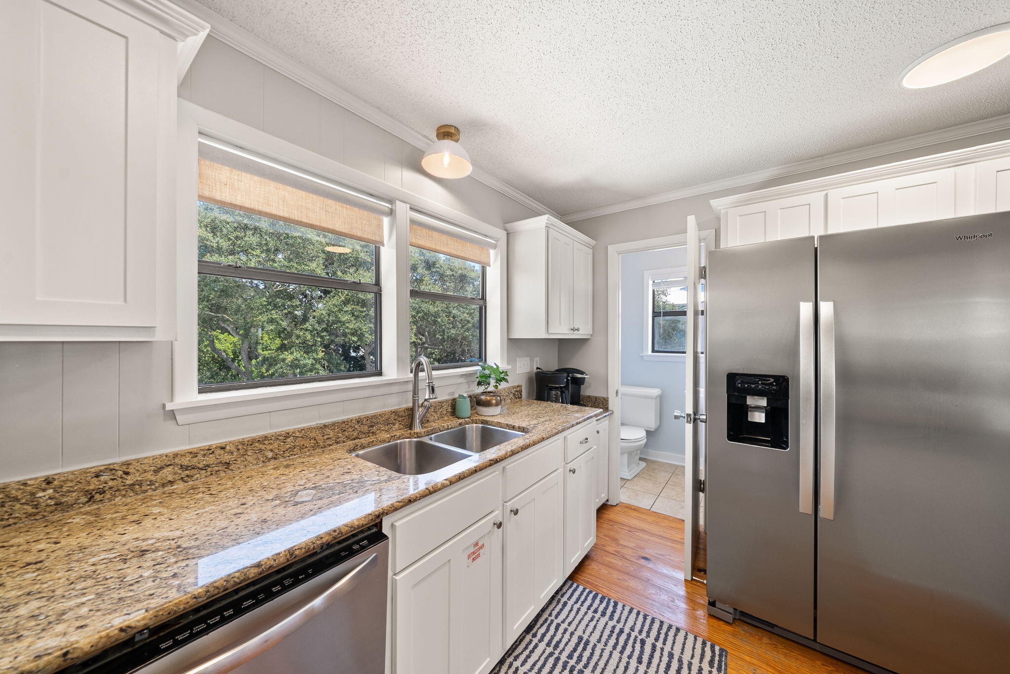8009 East County Highway 30A Inlet Beach, FL 32461 - Photo 37 of 56 a kitchen with a sink refrigerator and window