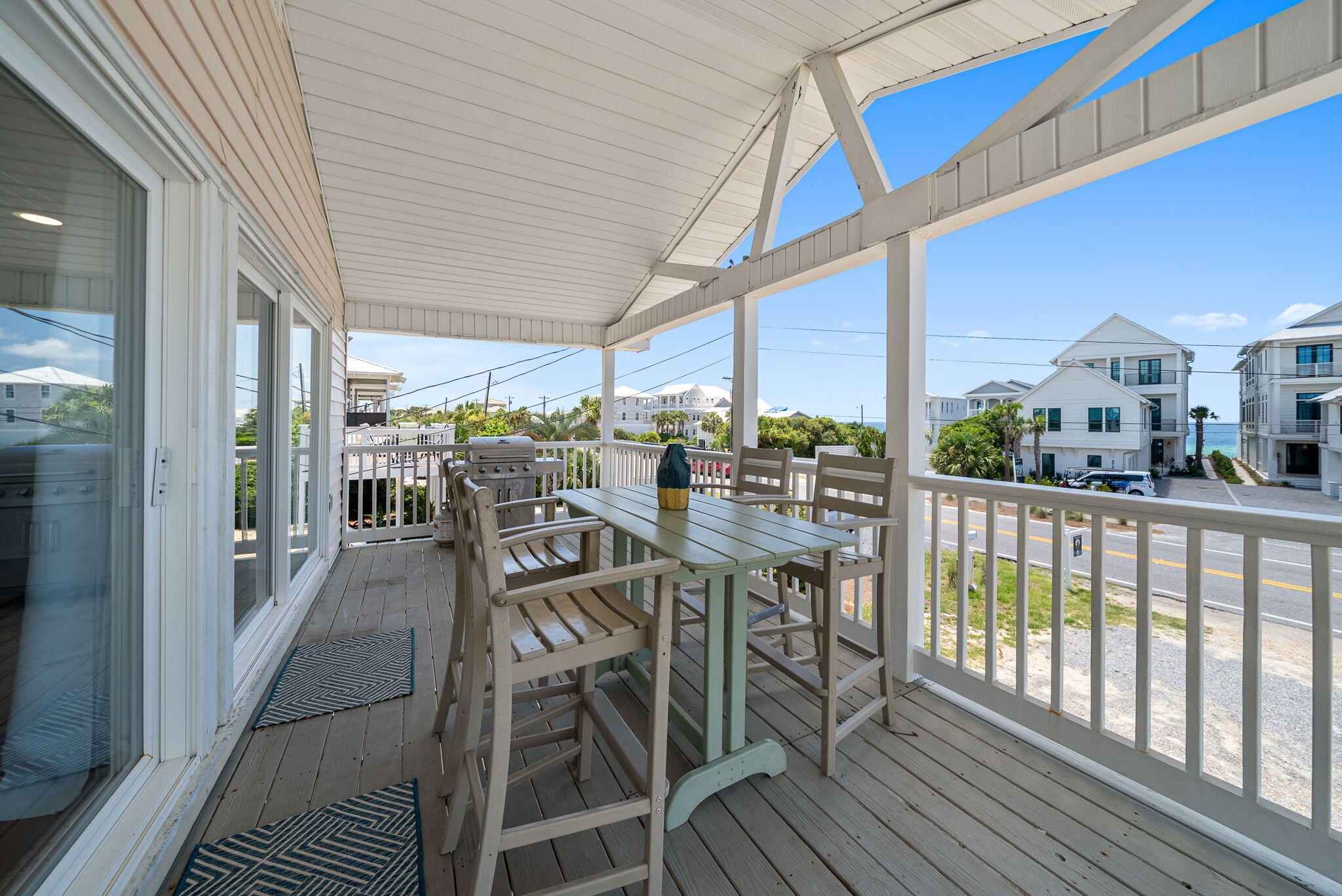 8009 East County Highway 30A Inlet Beach, FL 32461 - Photo 39 of 53 a view of a balcony with chairs and wooden floor