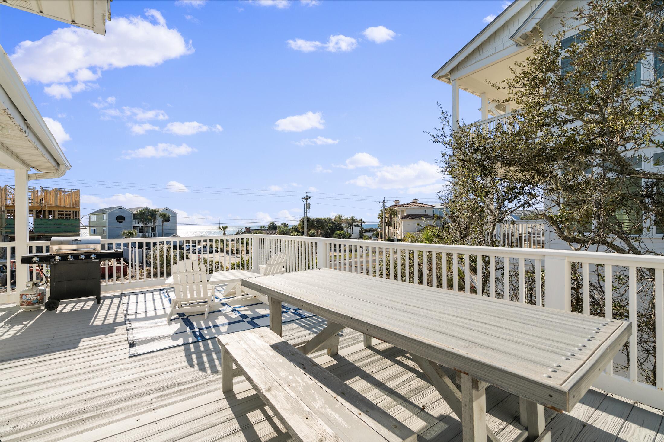 8009 East County Highway 30A Inlet Beach, FL 32461 - Photo 45 of 56 a view of a balcony with wooden floor and outdoor seating