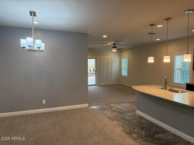 a view of a hallway with chandelier