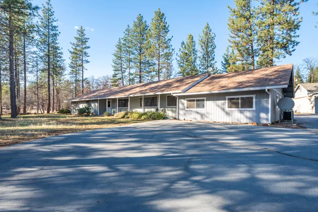 a view of house with a swimming pool