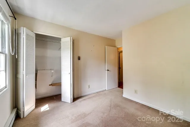 a view of a room with an entryway and closet