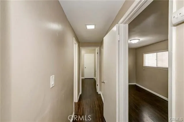 a view of hallway with stairs and a chandelier