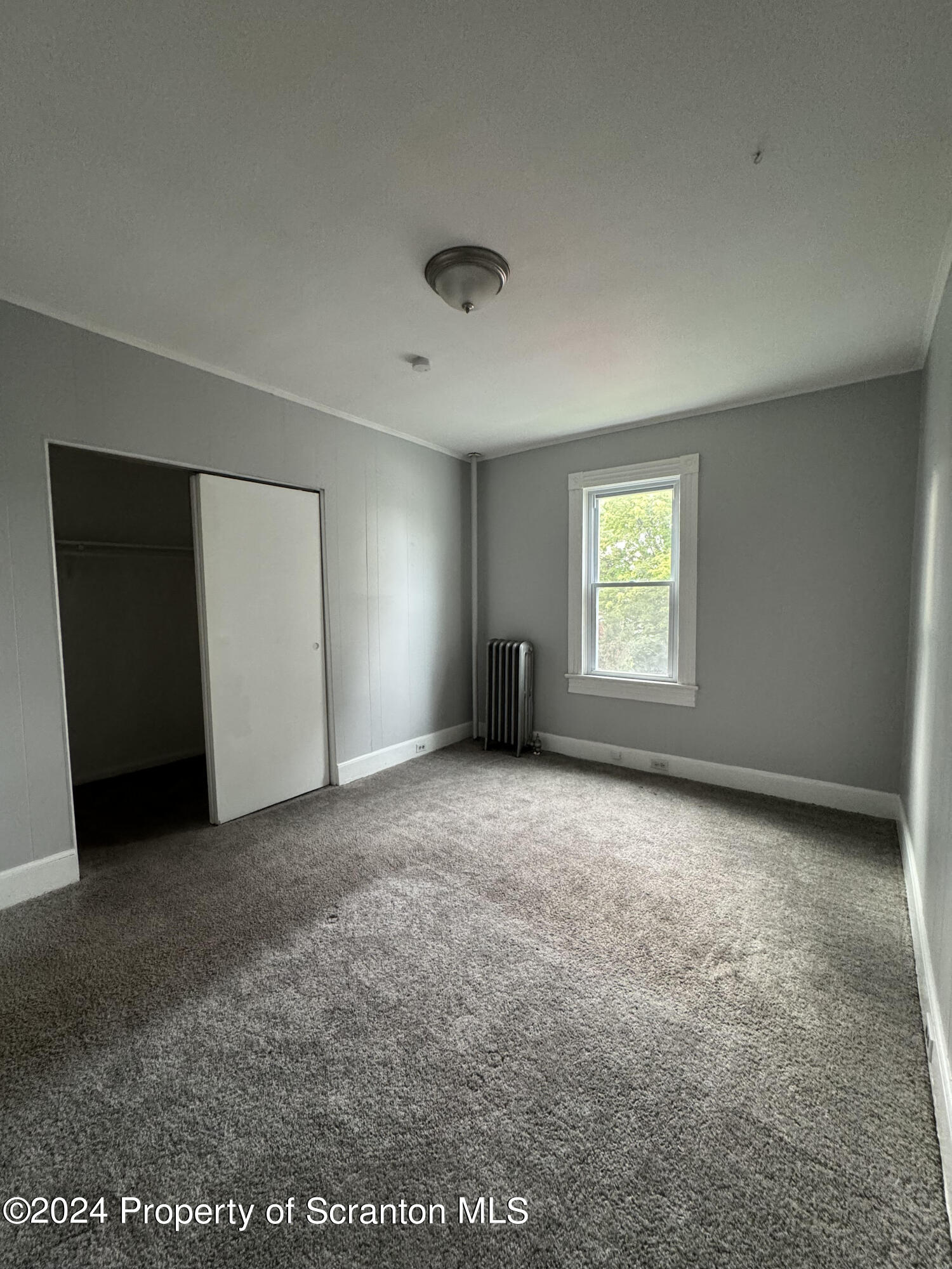 922 South Webster Avenue, Unit 1 Scranton, PA 18505 - Photo 8 of 11 an empty room with a window