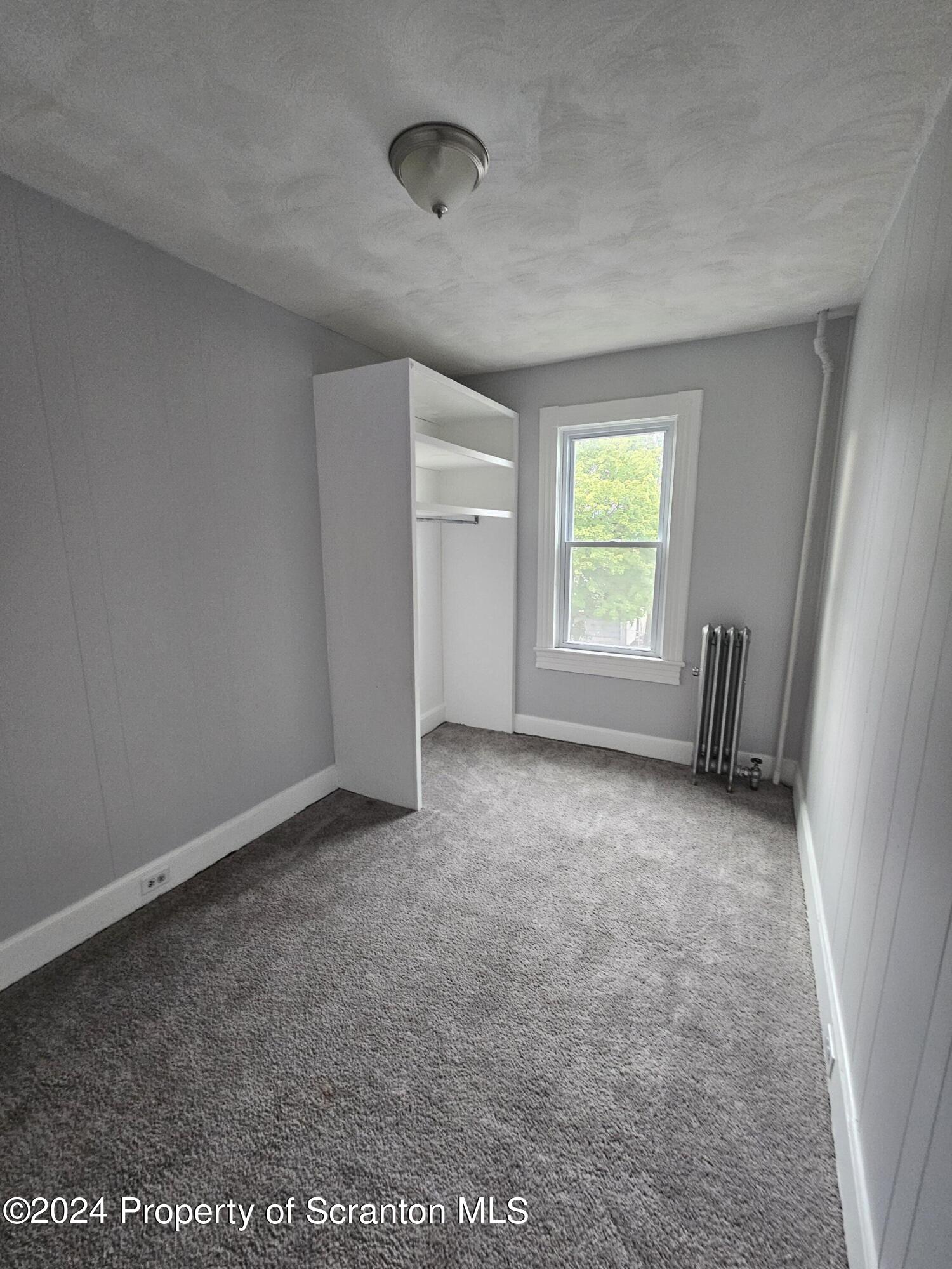 922 South Webster Avenue, Unit 1 Scranton, PA 18505 - Photo 9 of 11 a view of an empty room with a window