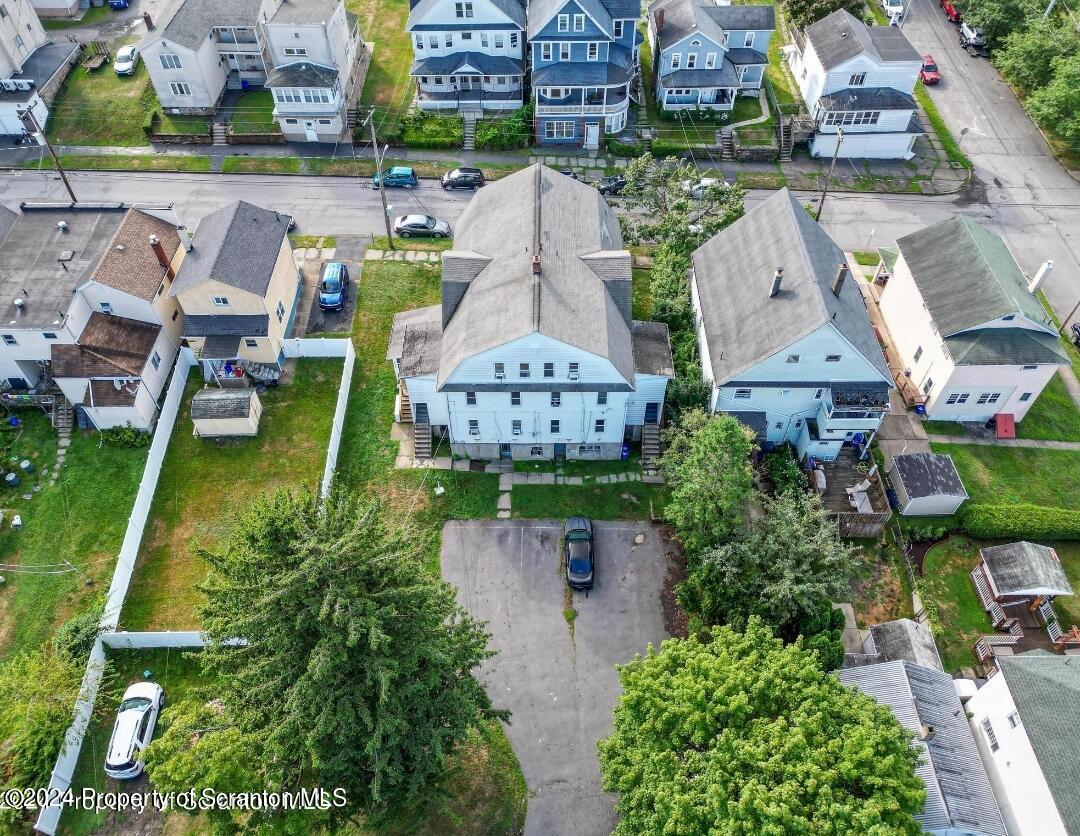 922 South Webster Avenue, Unit 1 Scranton, PA 18505 - Photo 10 of 11 an aerial view of a house with a garden and lake view
