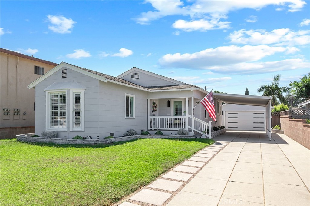 9716 Oak Street Bellflower, CA 90706 - Photo 1 of 1 a front view of house with yard