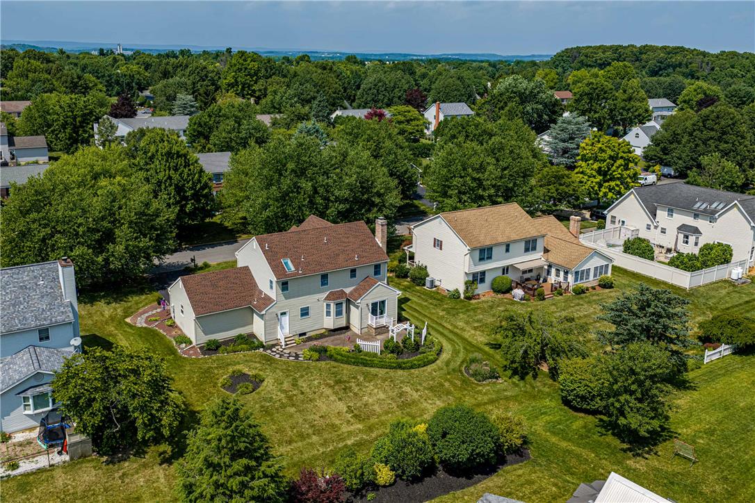 4568 Greenfield Road Bethlehem, PA 18017 - Photo 55 of 59 An aerial perspective reveals a serene suburban neighborhood with manicured lawns and mature trees.