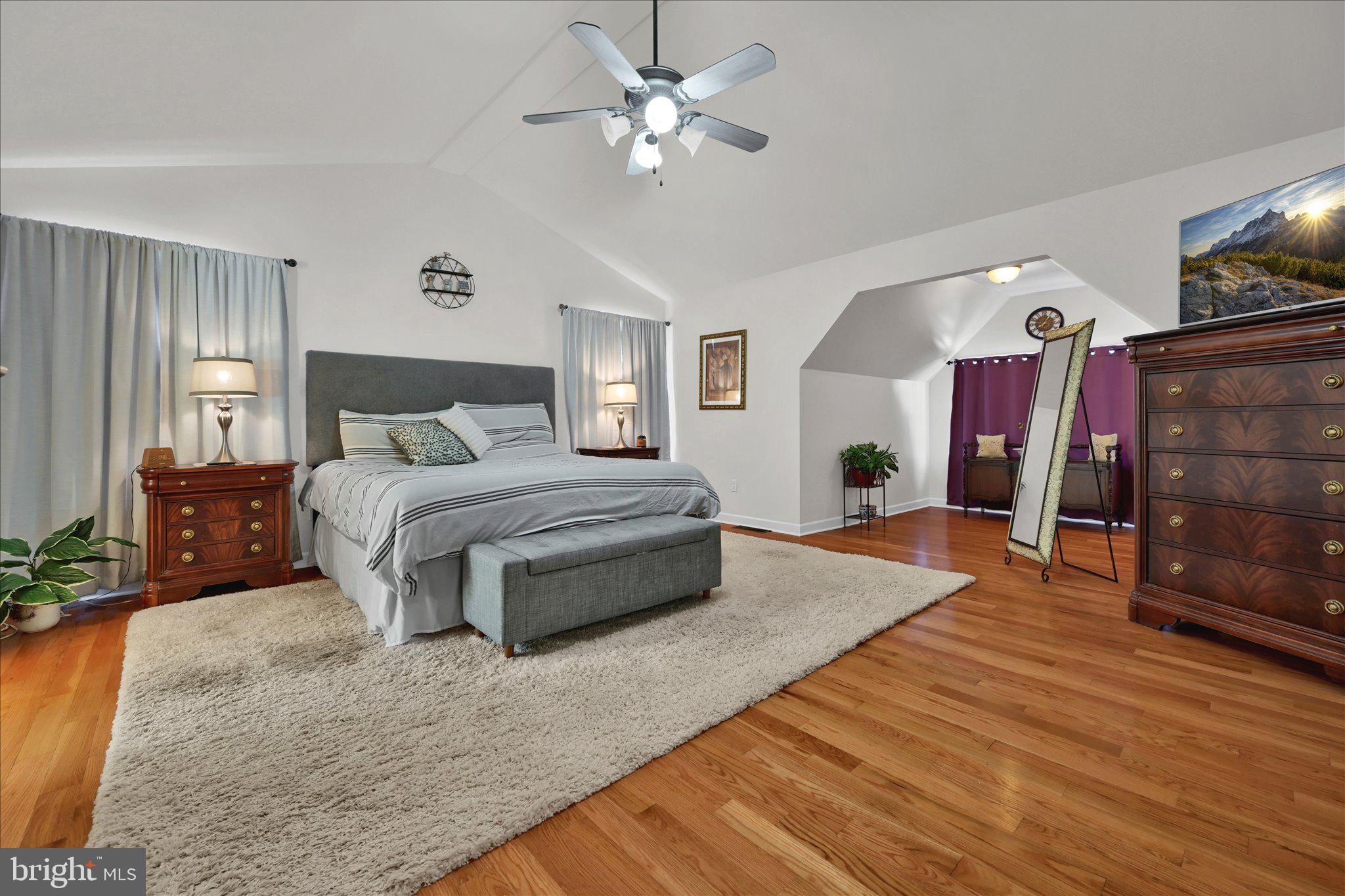 624 Stoney Run Road Pottsville, PA 17901 - Photo 20 of 40 a bedroom with a bed and dresser with wooden floor