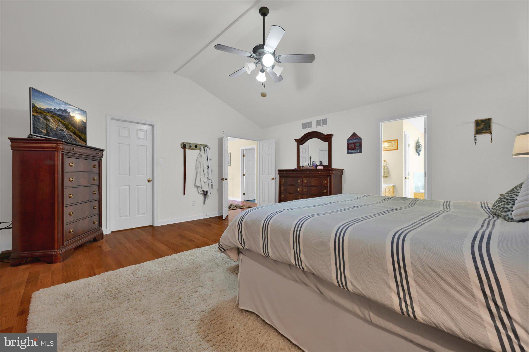 624 Stoney Run Road Pottsville, PA 17901 - Photo 21 of 40 a bedroom with a large bed and ceiling fan