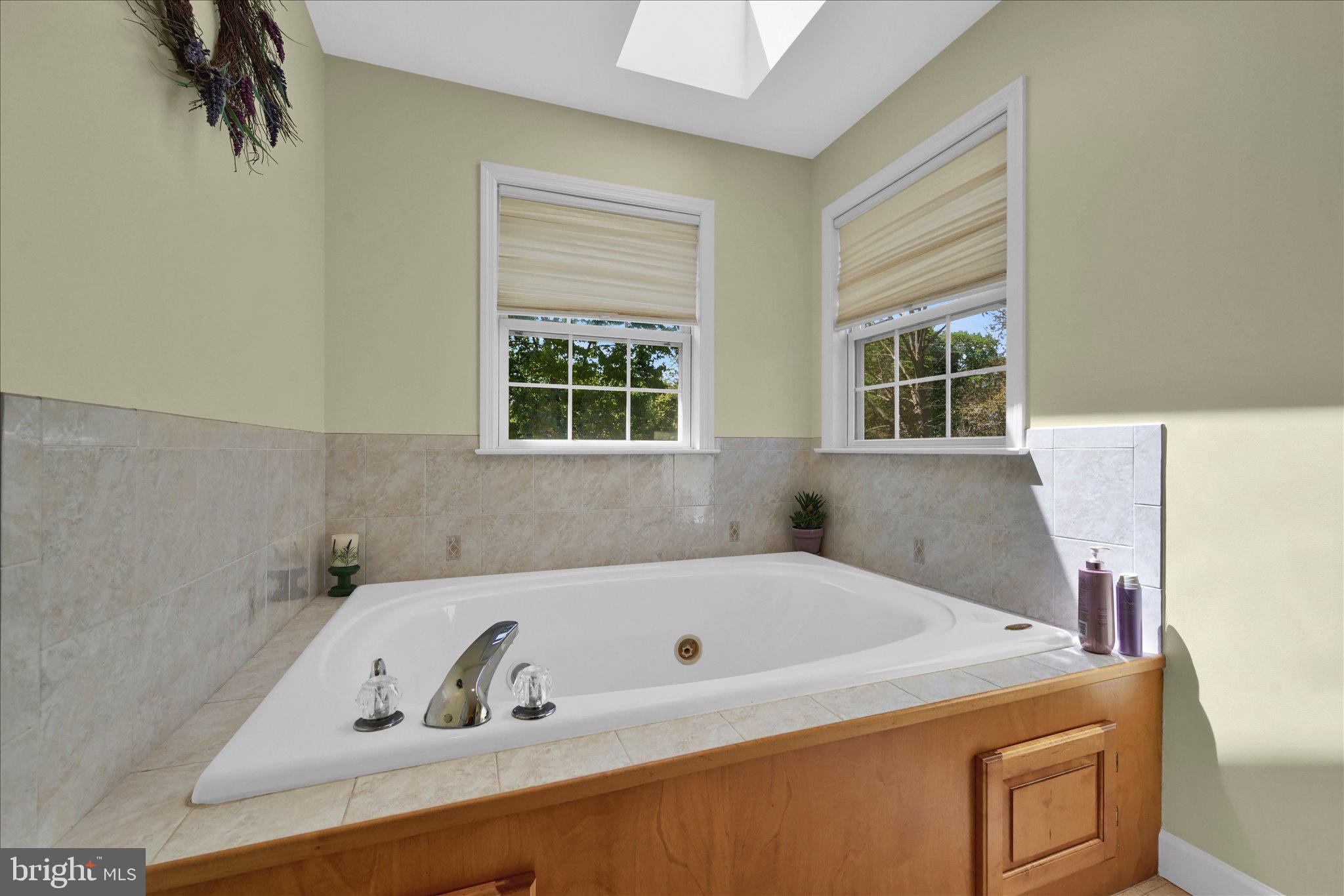 624 Stoney Run Road Pottsville, PA 17901 - Photo 24 of 40 a bathroom with a tub and a window