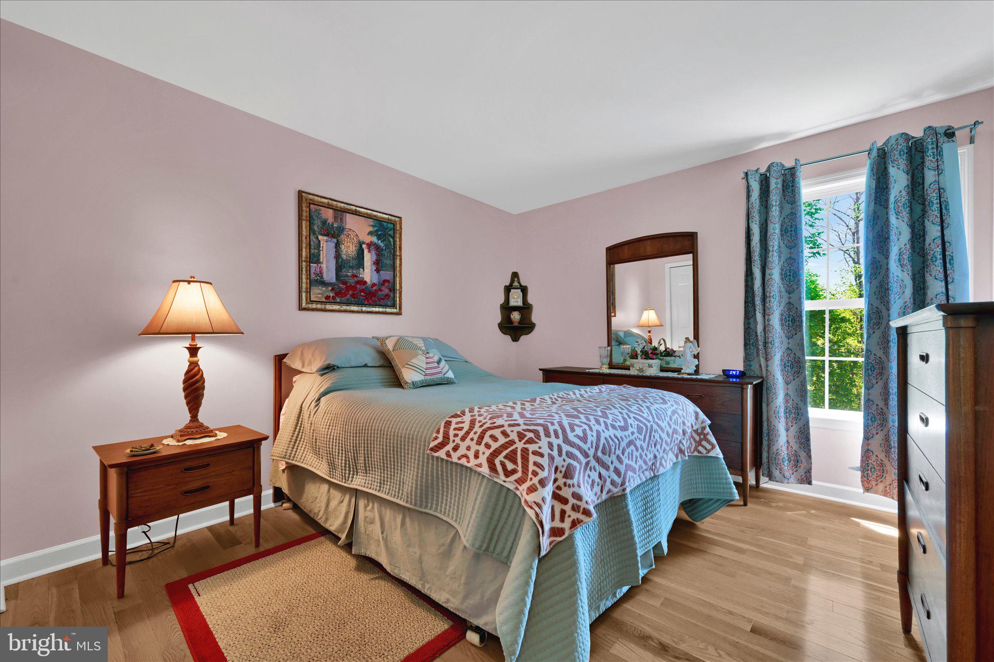 624 Stoney Run Road Pottsville, PA 17901 - Photo 28 of 40 a bedroom with a bed and a lamp on table