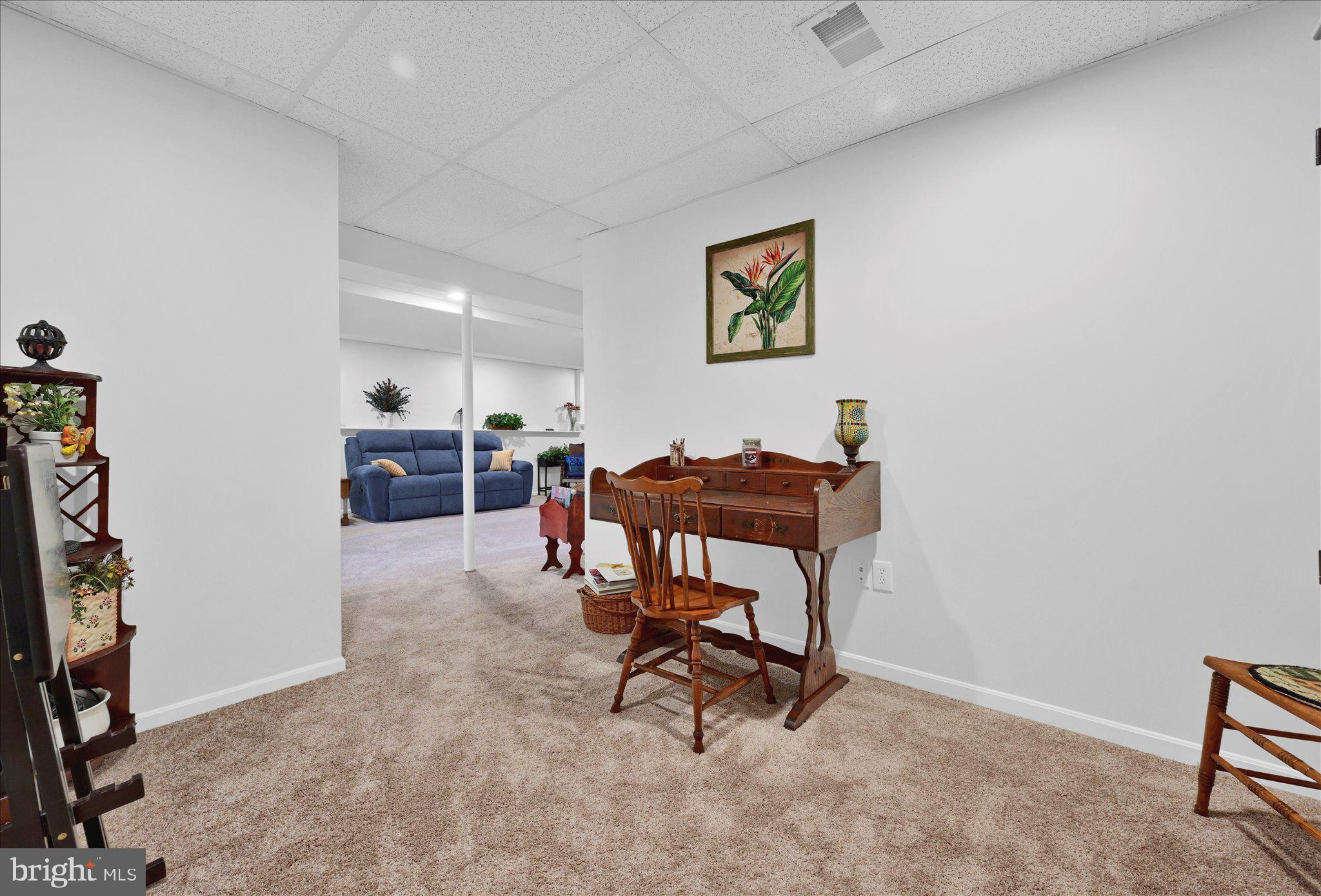 624 Stoney Run Road Pottsville, PA 17901 - Photo 30 of 40 a living room with furniture a piano and a flat screen tv