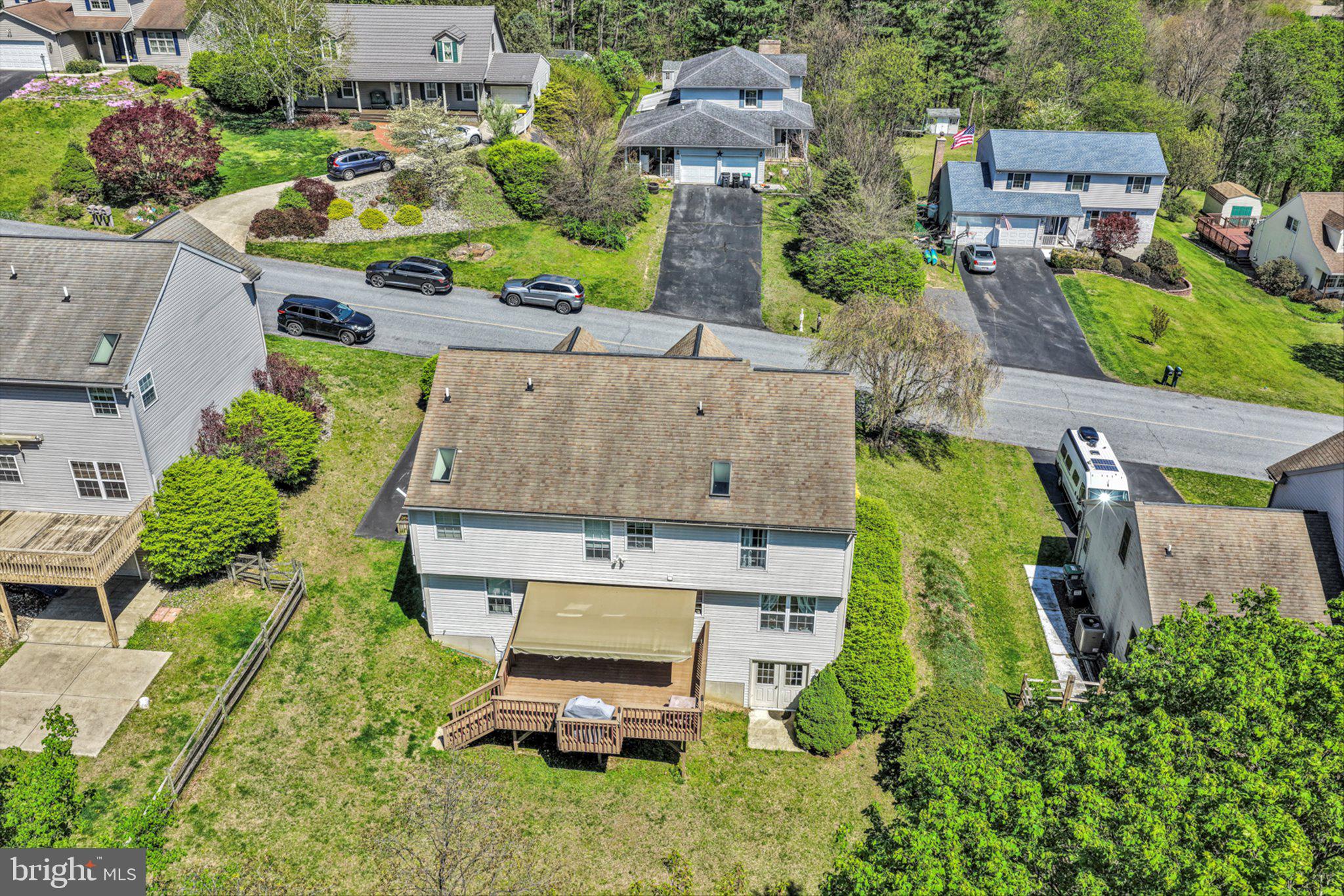 624 Stoney Run Road Pottsville, PA 17901 - Photo 39 of 40 an aerial view of a house with a garden and large trees